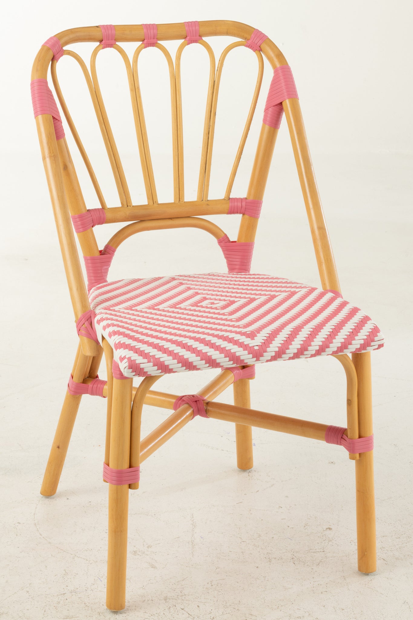 Eetkamerstoel rotan roze/wit