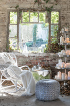 Witte rotan schommelstoel